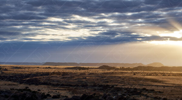 golden sun peering through the clouds