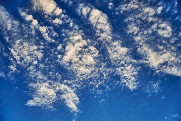 fluffy-white-clouds-against-a-bright-blue-sky