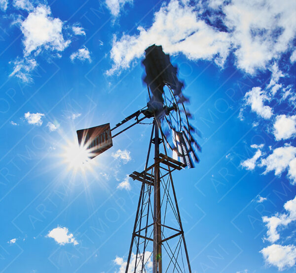 windmill against a bright blue sky