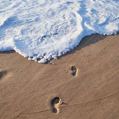 Footprints on a Sunny Beach