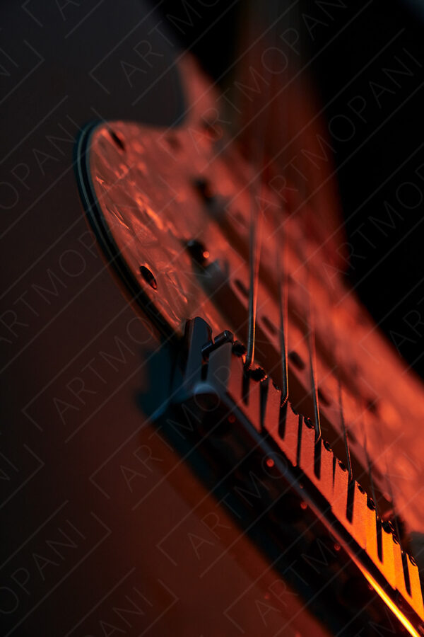 electric guitar up close & in moody light